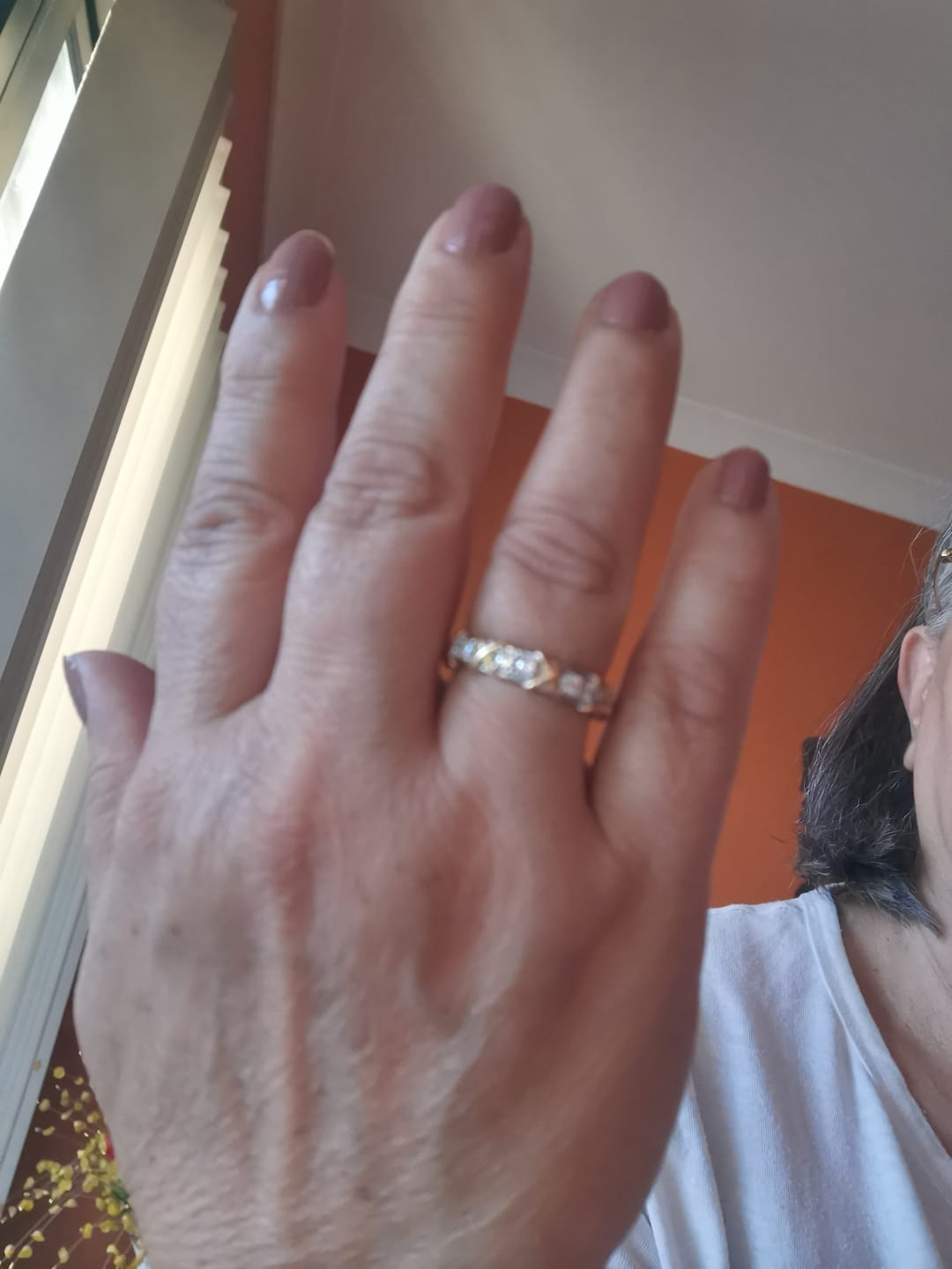 Customer photo review of Alternating Round Moissanite And Golden Xs Eternity Wedding Band Ring