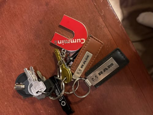 Customer's red Cummins Keychain on a keyring with other keys and Ram keychains.