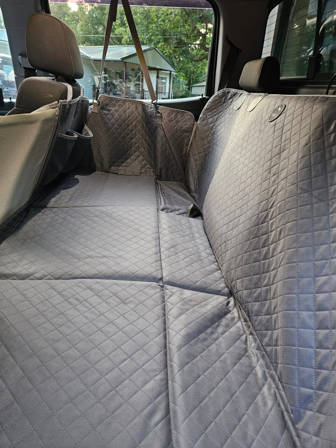 Customer photo review of NEW Waterproof Hard Bottom Car & Truck Seat Foldable Hammock Cover With Storage Pockets, Side Flaps, Headrest Straps, Seat Anchors, & Mesh Window (+FREE SAFETY BELT!)