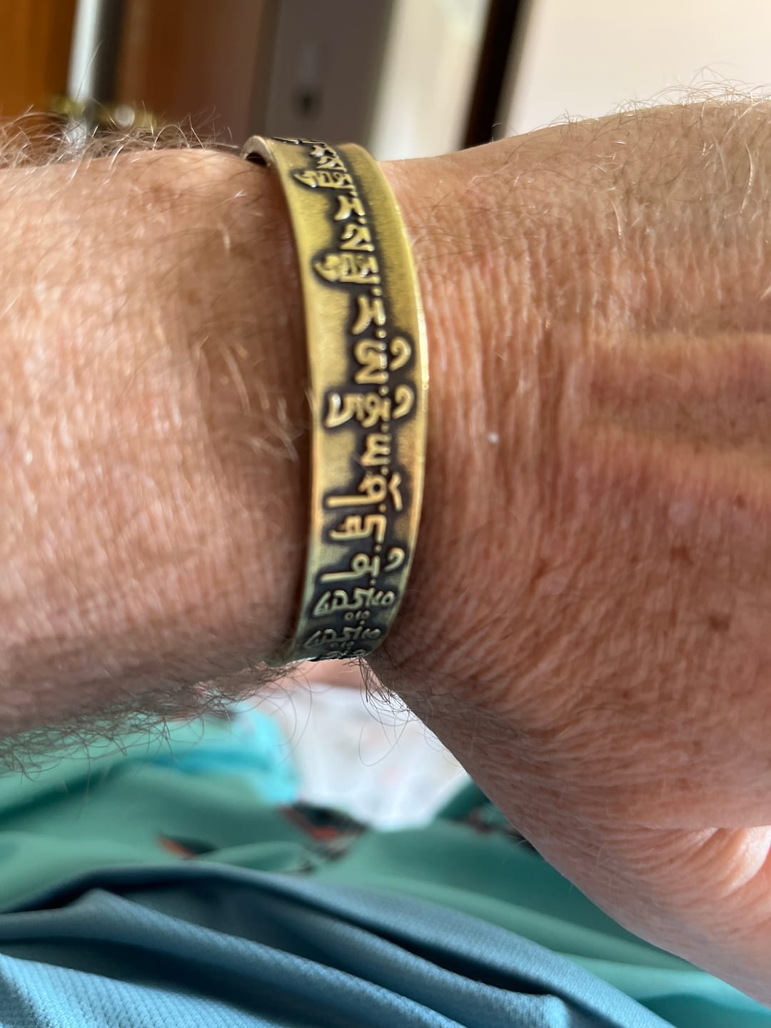 Customer photo review of Buddha Stones Tibetan Mahāpratisarā Mantra Sanskrit Copper Brass Healing Bracelet Bangle