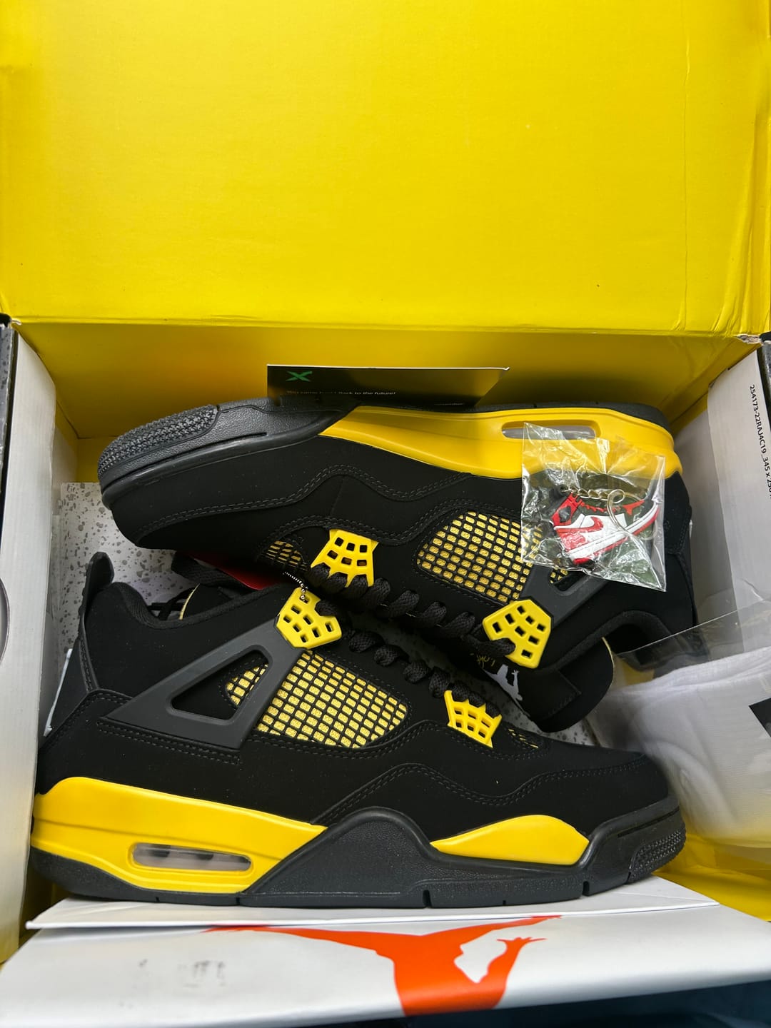 Customer photo review of Jordan 4 Retro 'Thunder' 2023