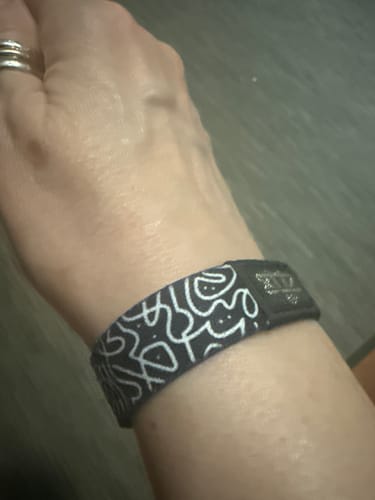 Customer showing the Believe In Yourself Bracelet on their wrist, highlighting the black and white pattern.