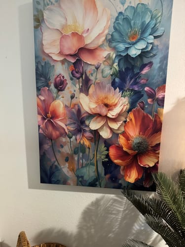 Customer's Spring Bouquet Wall Art canvas with colorful flowers hanging on a light wall.