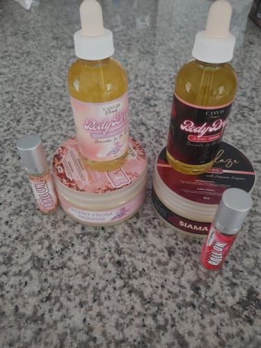 Customer's 'Scent from Heaven' trio and another body care set arranged on a countertop.