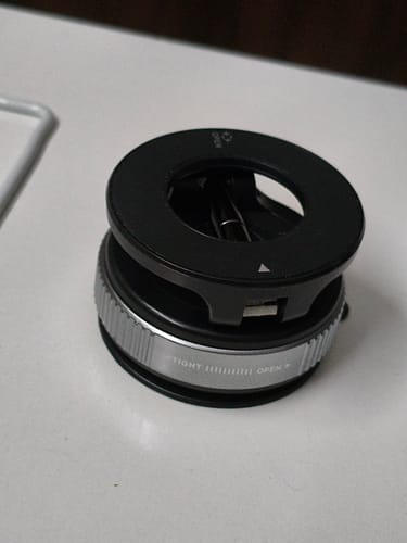 Customer's black and silver 360° MagPro Magnetic Phone Holder sitting on a white surface.