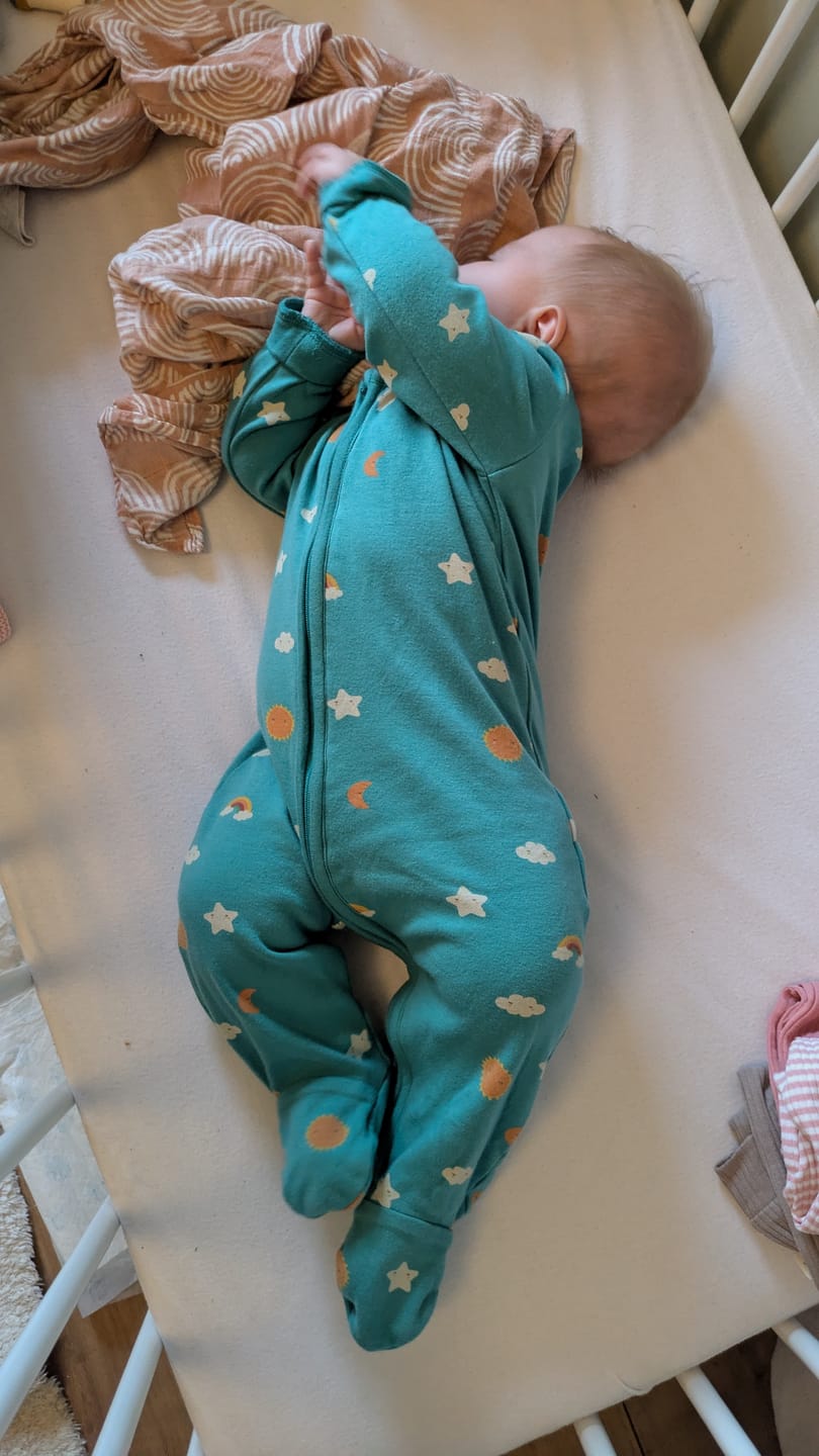 Customer photo review of Turquoise Skies Zip Organic Babygrow