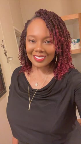 Customer smiling and showing her bright, white FIRST REMAKE Pop On Veneers.