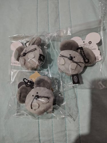 Customer's three gray DONGEUL COUNTRY MOUSE MINI KEYRINGs shown inside their original plastic packaging.
