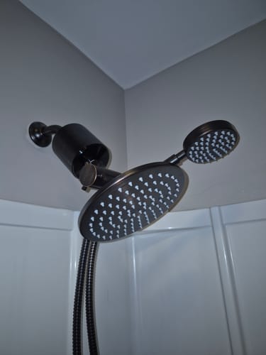 Customer's 1-Spray Dual Shower Head Set installed, showing the dark metal rain and handheld shower heads.