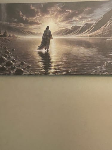 Customer's 'Walking on Water' faith wall art hanging on a wall, showing a peaceful depiction of a figure on water.