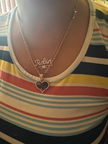 Reviewer wearing their personalized gold-tone Iced Heart Name Necklace with the name 'Robin'.