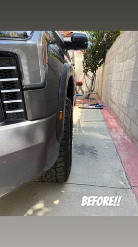 Customer photo of a gray truck's wheel before installing forged wheel spacers, showing a narrow stance.