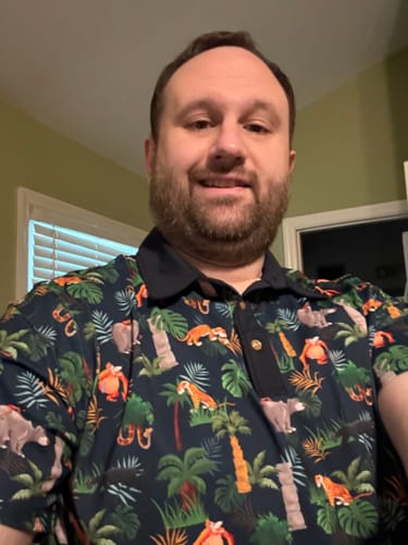 Reviewer wearing the patterned Disney's The Jungle Book 'Jungle Jam' All-Day Polo.