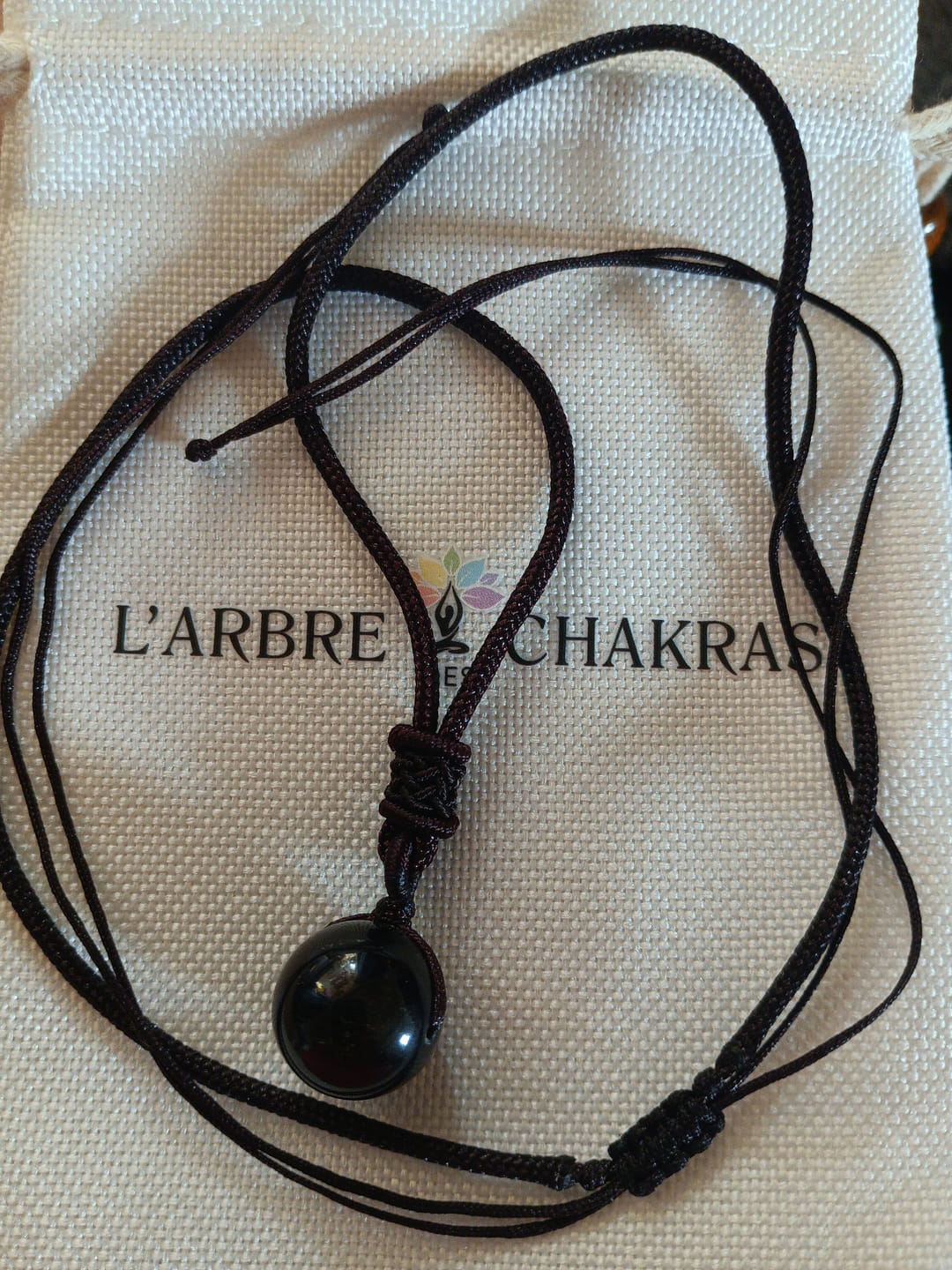 Customer photo review of Pendentif "Sphère" en Obsidienne Dorée