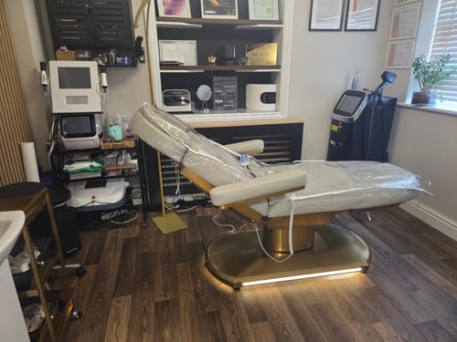 Reviewer's Manufakturo Étoile Beauty Bed in their studio, protected by a clear plastic cover.