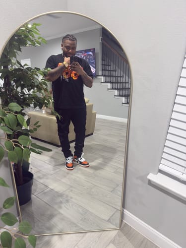 Reviewer wearing the black Denim Tears x Offset Set It Off Set 3 shirt in a full-length mirror selfie.
