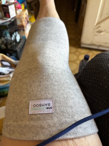 Customer wearing the snug-fitting, grey Premium Bamboo Knee Sleeve on their leg.