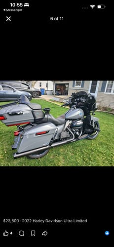 Customer's shiny gray motorcycle parked on a lawn after using Flowgenix Detailing Spray.