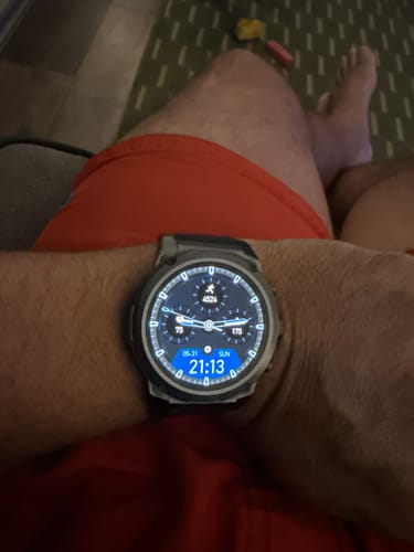 Close-up of a customer's Gard Pro Ultra 3 watch on their wrist, showing the illuminated digital face.