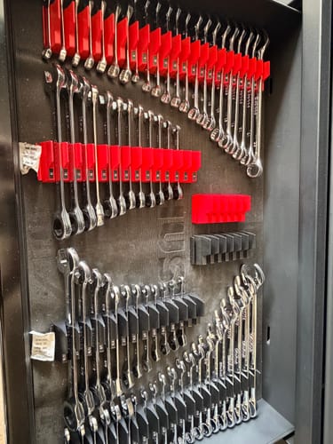 Reviewer's 120 Tooth Ratcheting Wrench Set neatly organized in red and black trays inside a tool drawer.