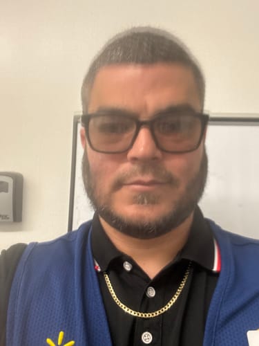Reviewer wearing the 14K Hollow Cuban Curb Chain over a black collared shirt.