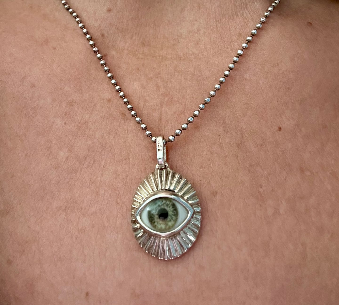 Customer photo review of Mini Starburst Eye Pendant