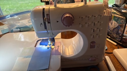 Customer's Universal Extension Table attached to a sewing machine, providing a large surface for quilting.