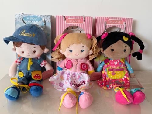 Customer's three colorful Leya dolls, including two Sunnyheart Girl dolls with different skin tones, sitting together.