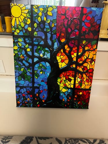 Reviewer's completed painting from the Stained Glass Seasons Tree kit, showing the vibrant four-season design.