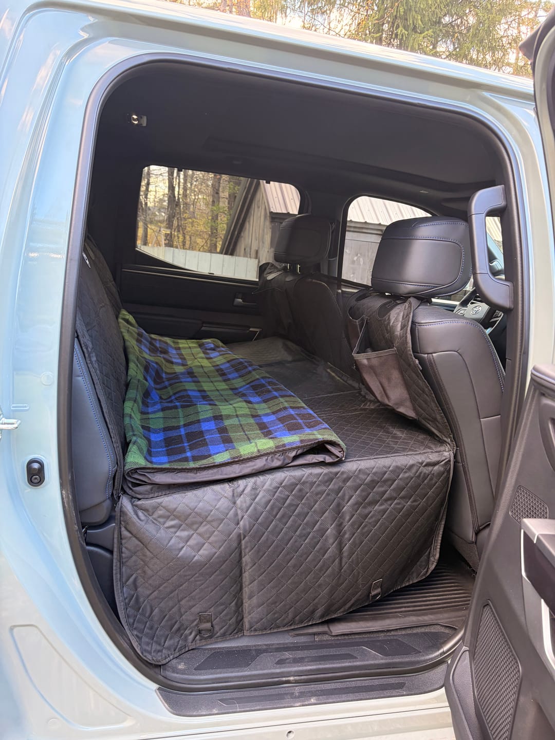 Customer photo review of NEW Waterproof Hard Bottom Car & Truck Seat Foldable Hammock Cover With Storage Pockets, Side Flaps, Headrest Straps, Seat Anchors, & Mesh Window (+FREE SAFETY BELT!)