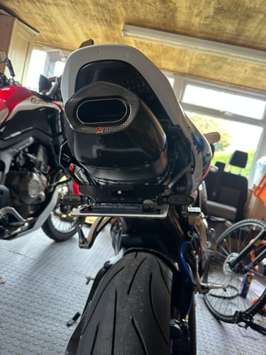 Reviewer's rear view of their Honda CBR600RR with a clean, low-profile tail tidy installed.