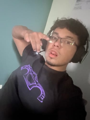 Customer wearing the black 80Eighty® DCG88 Shirt with a purple automotive graphic.