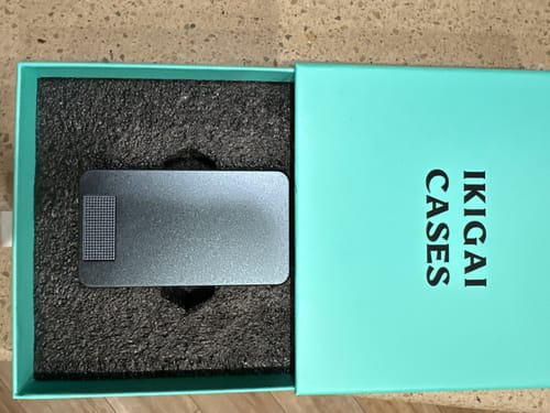 Customer's sturdy, gunmetal pill case from the 2-Pack Bundle shown in its open box.