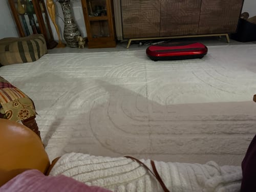 Customer's cream Cloud Haven Mat showing the carved 3D pattern on a living room floor.
