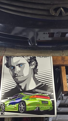 Customer's "Dude, I almost Had You!" poster with detailed art of a man's face and a green car.