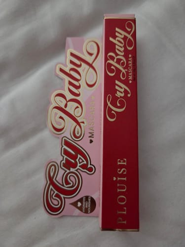 Customer's packaging for the P.Louise Cry Baby Mascara, showing the red Christmas box and the pink original box.