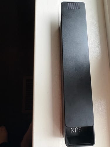 Reviewer's black Weekly AM-PM Vitamin XL Case 2.0, slightly open to show the 'SUN' day compartment.