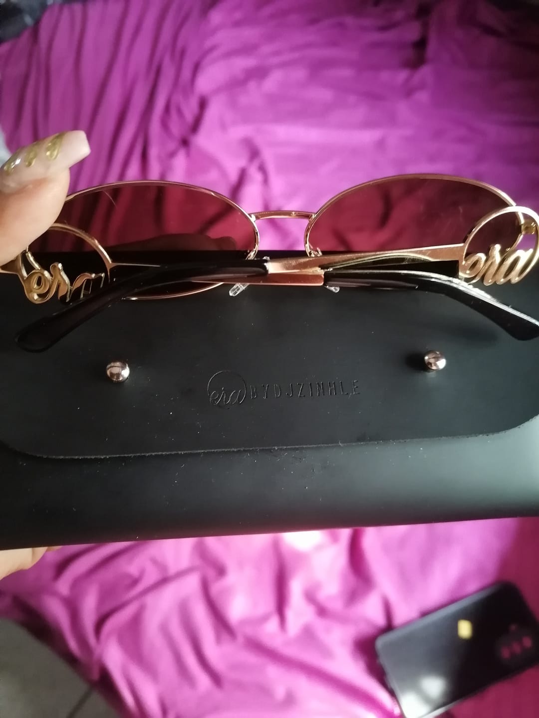 Customer photo review of Muse Logo Sunglasses – Gold Edition