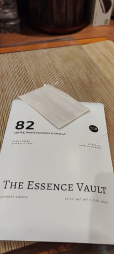 Customer's white packaging for 'Inspired By Black Opium - 82' laundry sheets with one single sheet placed on top.
