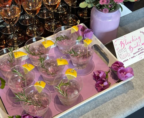 Customer's tray of light pink 'Blushing Bride' cocktails made using the Lavender Syrup for an event.