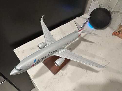 Customer's American 737-800 model airplane shown from above, assembled on its wooden stand.