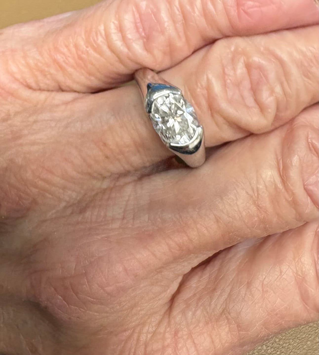 Customer photo review of Solitaire Oval Moissanite Half Bezel Set Engagement Ring