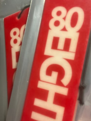 Close-up of a customer's red 80Eighty Smoke Ice Air Freshener in its packaging.