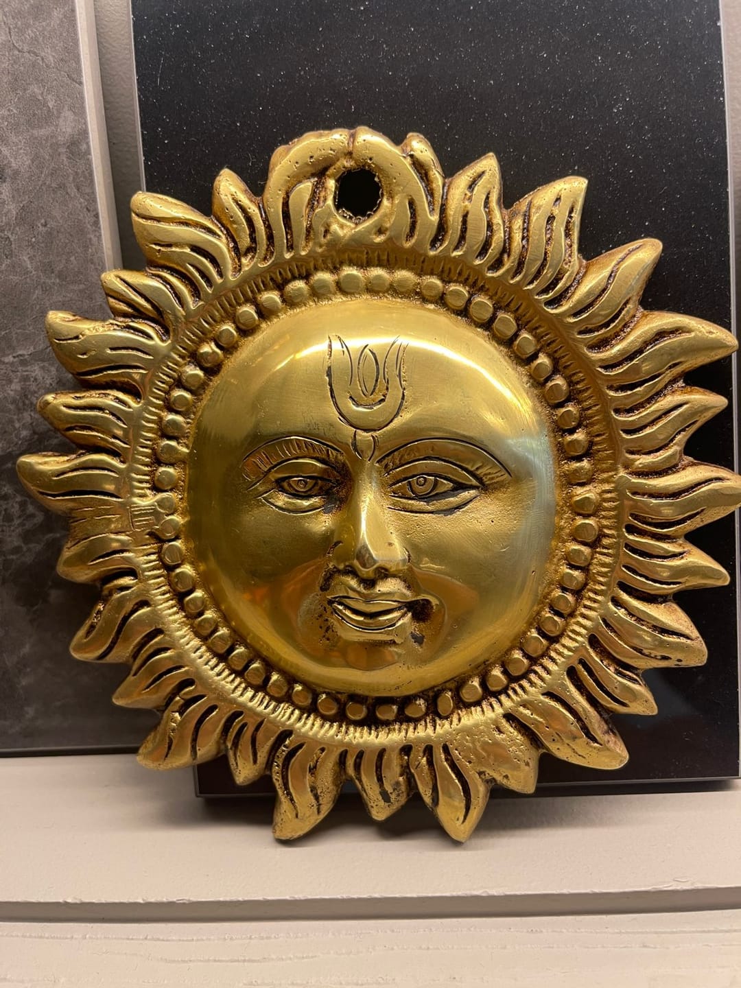 Customer photo review of Brass Vastu Sun Wall Hanging Idol Vastu Remedy for East Direction Balance, Fame and Positive Energy for Home, Office and Entrance Decor | 15 x 15 cm | 800 g