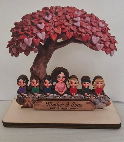 Customer's personalized wooden plaque with a mother and six children sitting under a large heart tree.