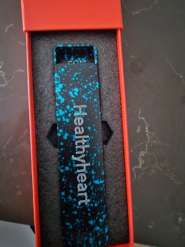 Customer's engraved Weekly Case with a blue splatter design in its box.