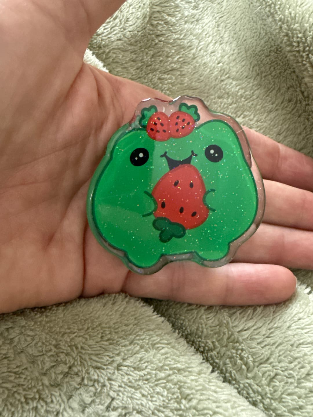 Customer photo review of Acrylic Page Clip with Glitter Overlay, Freddy the Frog by Wook Books