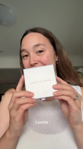 Customer holding the box containing the Mama Letter Chain Necklace.