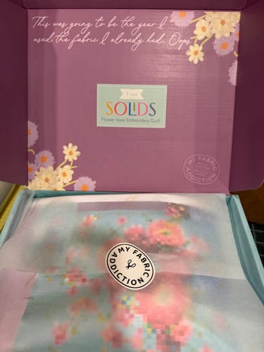 Customer's Tilda Embroidery Flower Vase Precut Quilt Kit arriving in its purple packaging box.