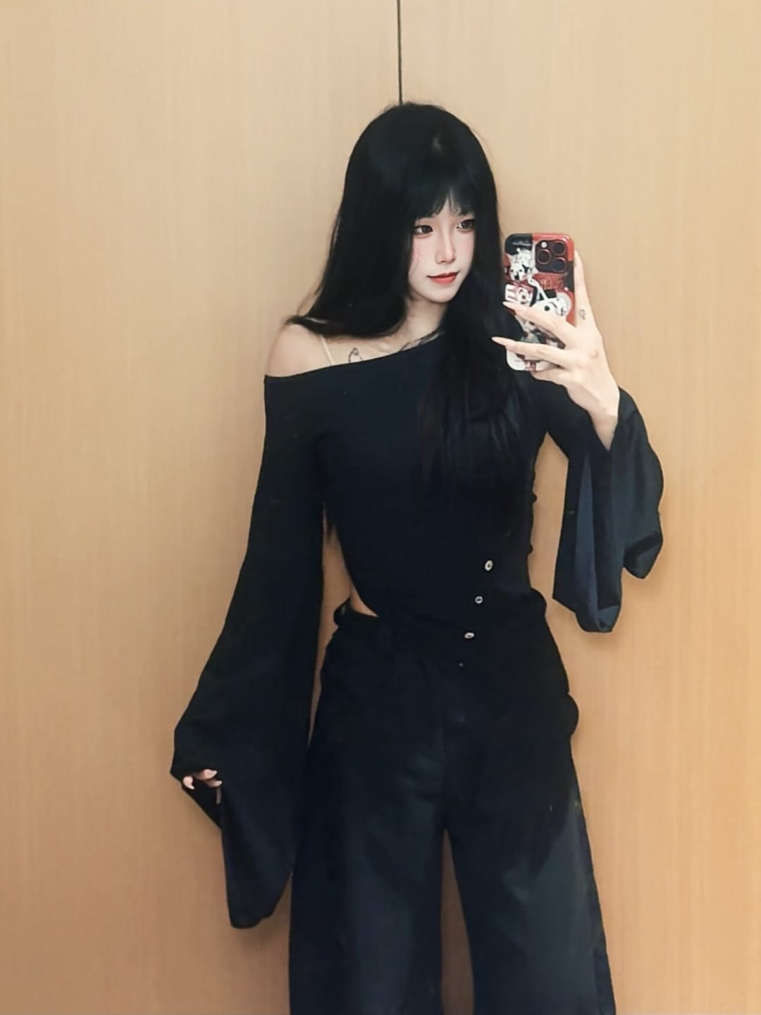 Customer photo review of DOINDULGE Asymmetric Draped One-Shoulder Top